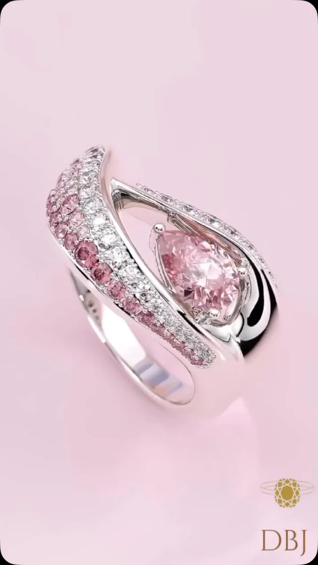 Soft in hue, strong in sparkle. 💖✨
This pink sapphire and diamond-studded ring is where grace meets brilliance — made to shine with every glance.

#PinkSapphireRing #DiamondElegance #LuxuryJewelry #DBJJewelry #GemstoneGlow #StatementRing #FineJewels #FeminineSparkle #CraftedToShine #JewelryGoals
